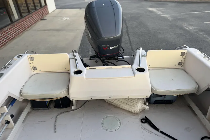 Slide: The Image of 2001 Grady-White Freedom 192 boat interior with Yamaha V6 200 engine. - 10