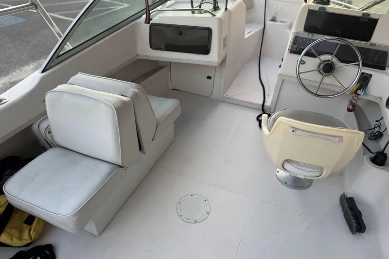 Slide: The Image of 2001 Grady-White Freedom 192 boat interior with steering wheel and seating. - 11