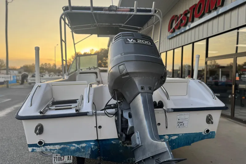 Slide: The Image of 2001 Grady-White Freedom 192 boat with V6 200 engine at sunset near dealership. - 4