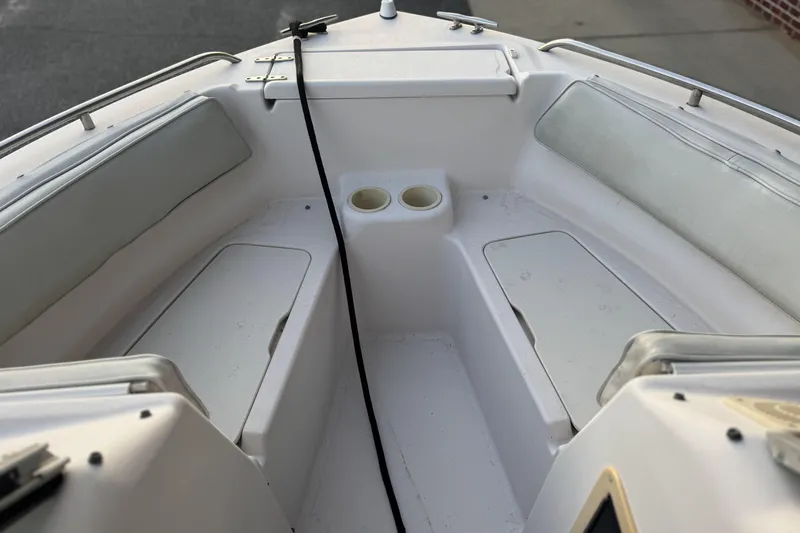 Slide: The Image of 2001 Grady-White Freedom 192 boat interior with seating and storage compartments. - 8