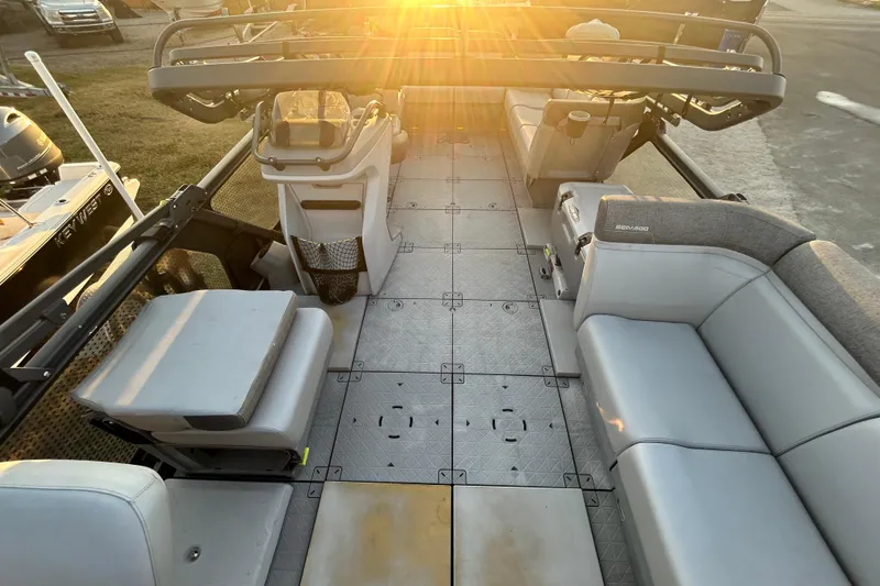Slide: The Image of 2022 Sea-Doo Switch Sport 21 interior with seating and control console. - 14