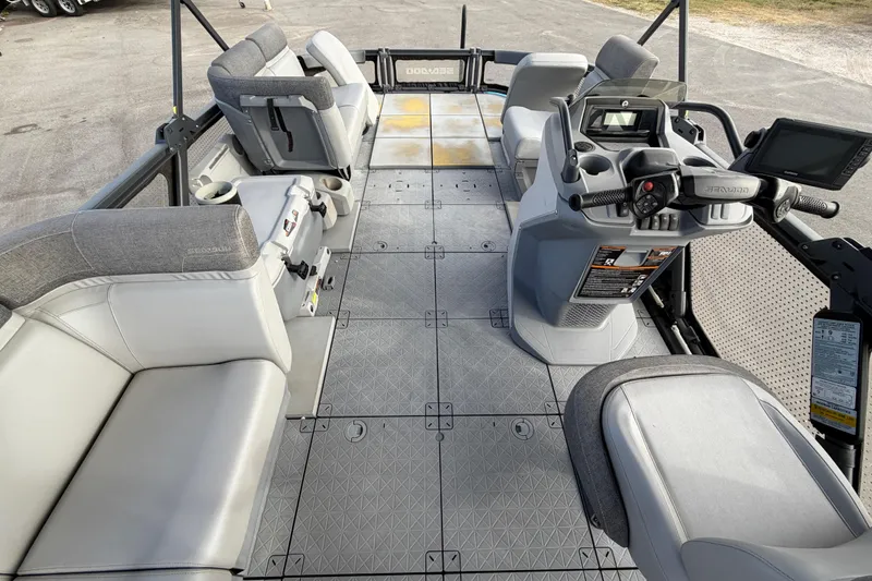Slide: The Image of 2022 Sea-Doo Switch Sport 21 dashboard with steering wheel and control panel. - 19