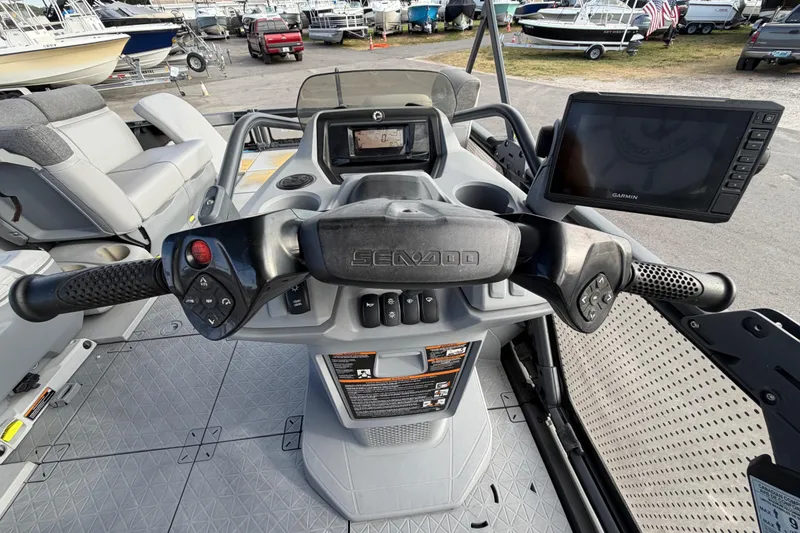 Slide: The Image of 2022 Sea-Doo Switch Sport 21 dashboard with control switches and warning labels. - 22