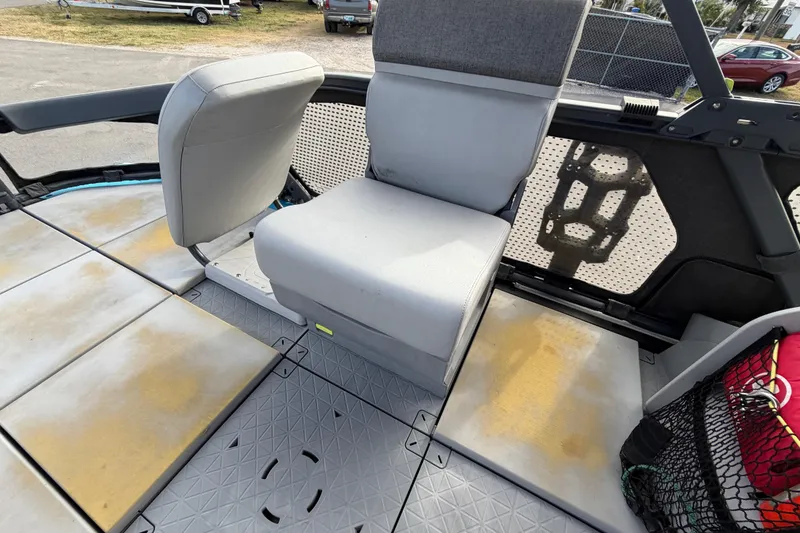 Slide: The Image of 2022 Sea-Doo Switch Sport 21 pontoon boat interior with seating and canopy. - 32