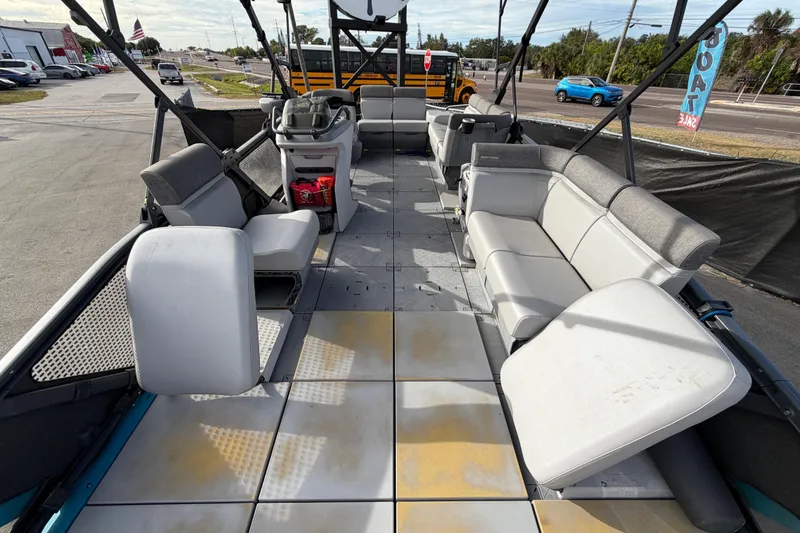 Slide: The Image of 2022 Sea-Doo Switch Sport 21 interior with seating, steering console, and storage. - 35