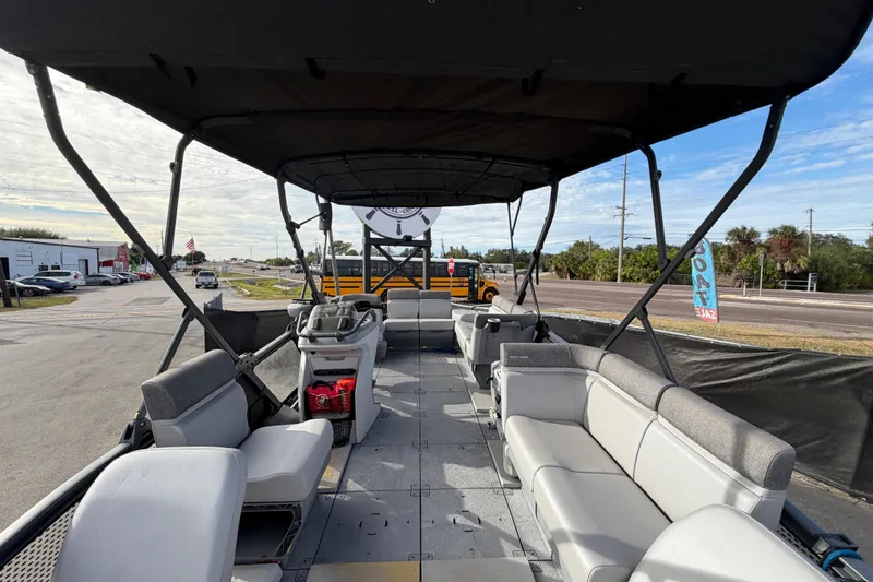 Slide: The Image of Interior of 2022 Sea-Doo Switch Sport 21 with storage box and cup holders. - 36