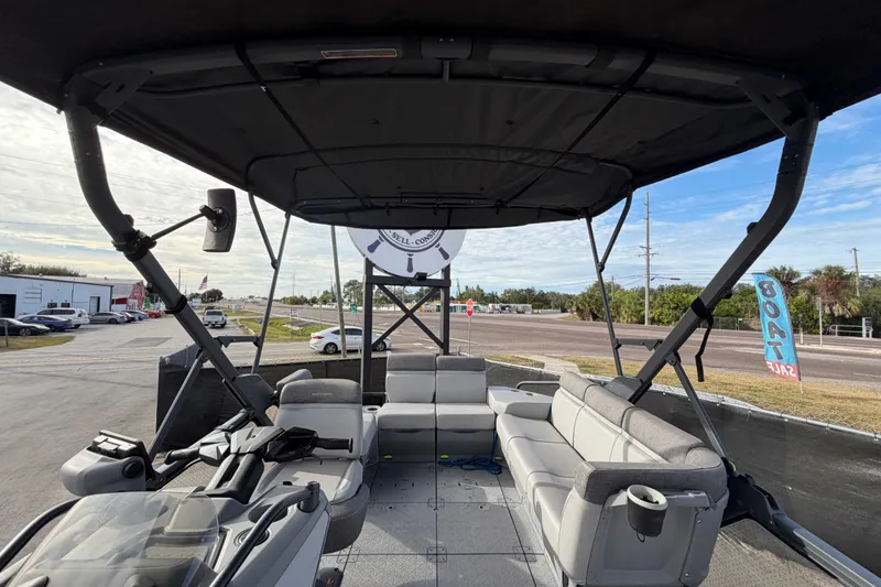 Slide: The Image of 2022 Sea-Doo Switch Sport 21 interior with gray seating and spacious deck layout. - 43