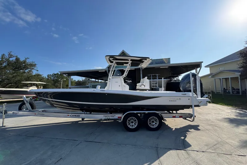 The Image of 2020 Caymas 28 HB boat on trailer under clear blue sky. - 1