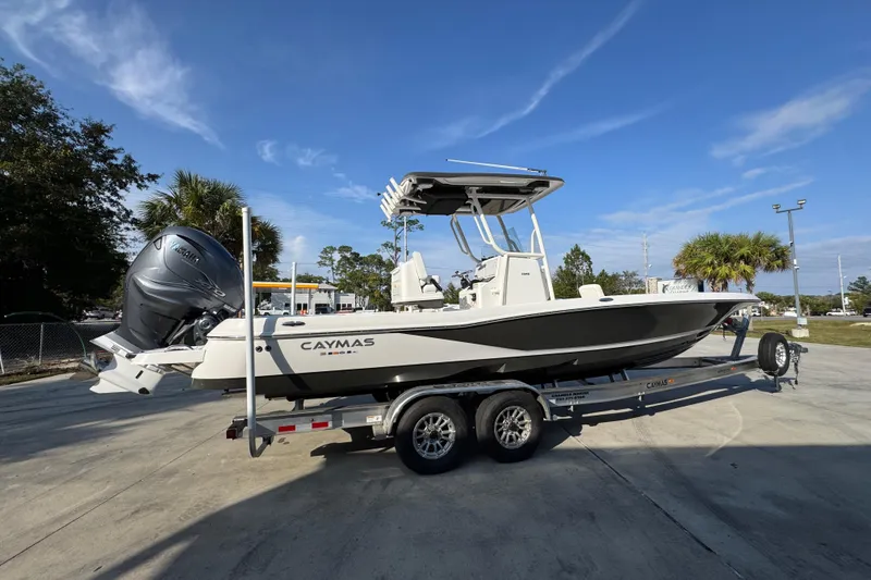 Slide: The Image of 2020 Caymas 28 HB boat on trailer under clear blue sky. - 12