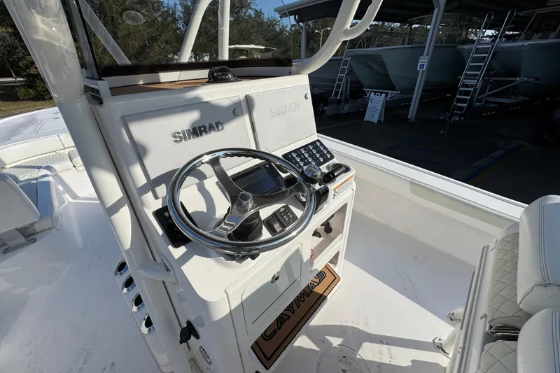 Slide: The Image of 2020 Caymas 28 HB boat console with Simrad electronics and steering wheel. - 30