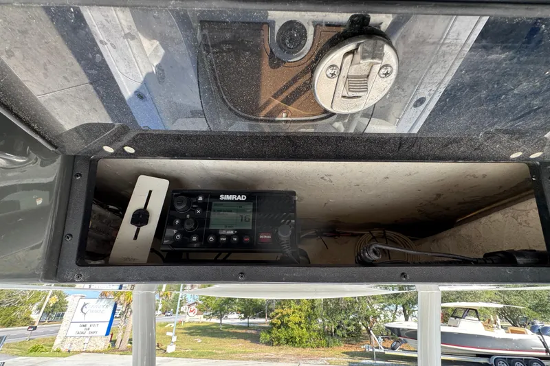 Slide: The Image of 2020 Caymas 28 HB boat console with Simrad marine electronics and storage compartment. - 33