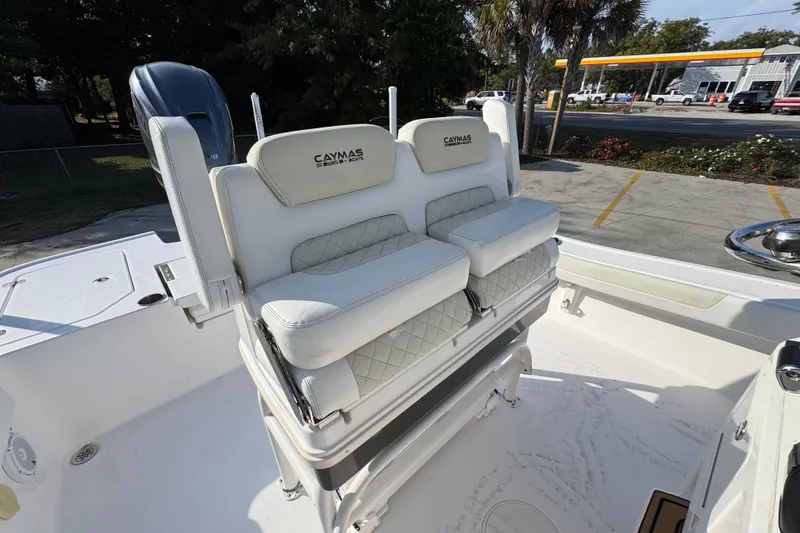 Slide: The Image of 2020 Caymas 28 HB boat with white cushioned seating and sleek design. - 35