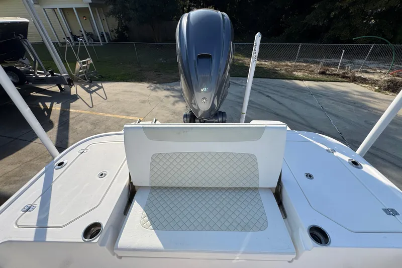 Slide: The Image of 2020 Caymas 28 HB boat with Yamaha outboard engine, viewed from the rear deck. - 39