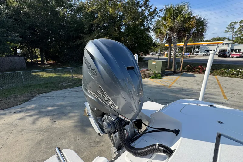 Slide: The Image of 2020 Caymas 28 HB boat with Yamaha outboard motor in a sunny outdoor setting. - 41