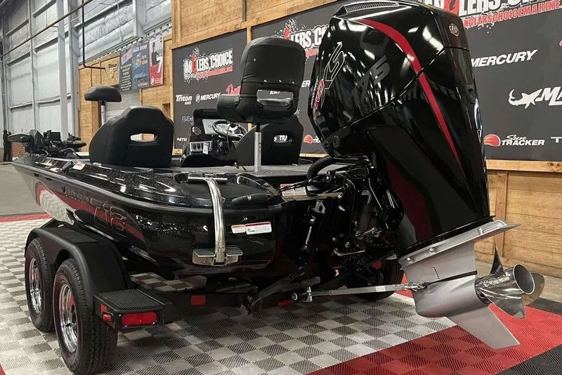 Slide: The Image of 2026 Nitro Z18 Pro boat with powerful engine on display in showroom. - 5