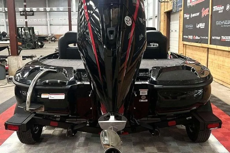 Slide: The Image of 2026 Nitro Z18 Pro boat in showroom, rear view with powerful engine. - 7