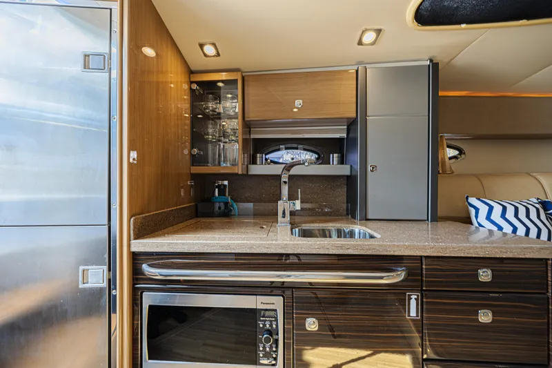 Slide: The Image of Interior of 2013 Formula 400 Super Sport yacht kitchen with modern amenities. - 16