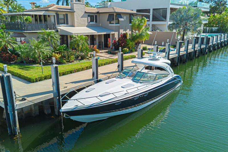 Slide: The Image of 2013 Formula 400 Super Sport yacht docked by luxurious waterfront homes. - 4