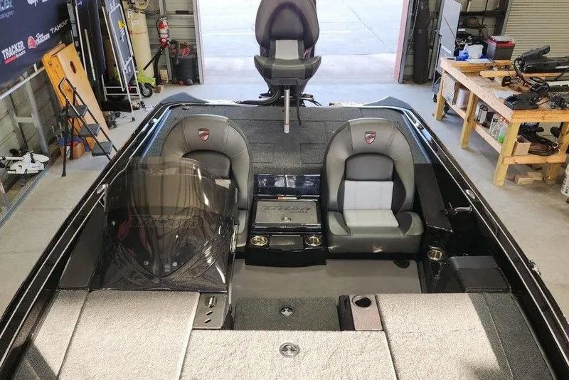 Slide: The Image of 2026 Triton 19 TrX Patriot boat interior in a workshop setting. - 9