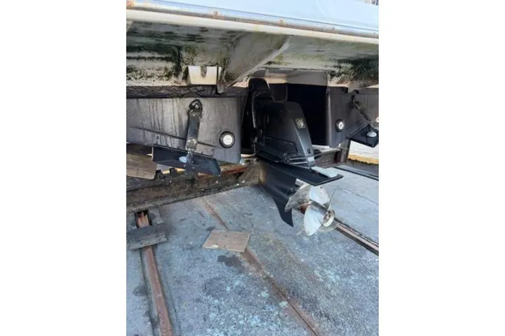 Slide: The Image of 2013 Regal 28 Express boat stern with propeller and outdrive visible. - 37