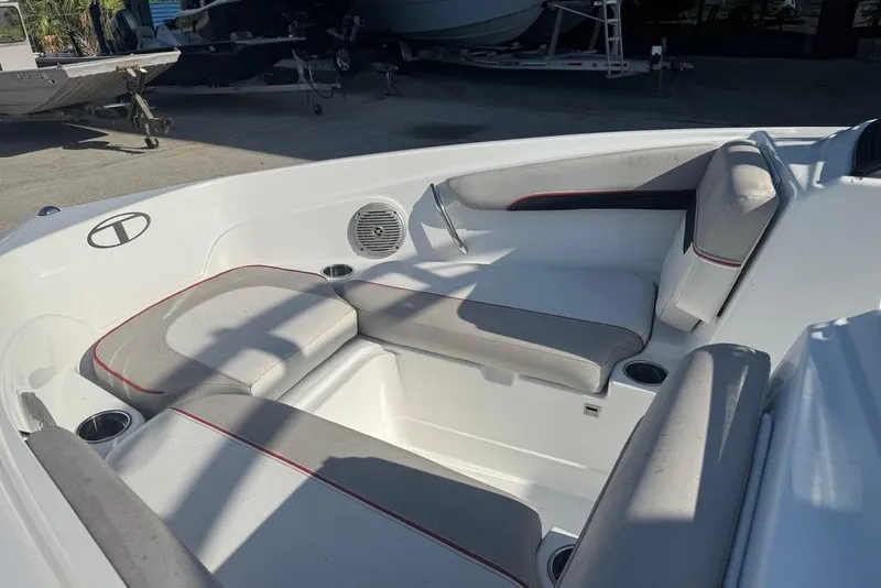 Slide: The Image of Interior of a 2018 Tahoe 700 TF boat with cushioned seating. - 11