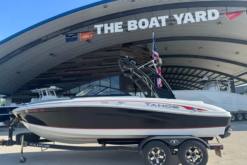 Slide: The Image of 2018 Tahoe 700 TF boat on trailer at The Boat Yard dealership. - 16