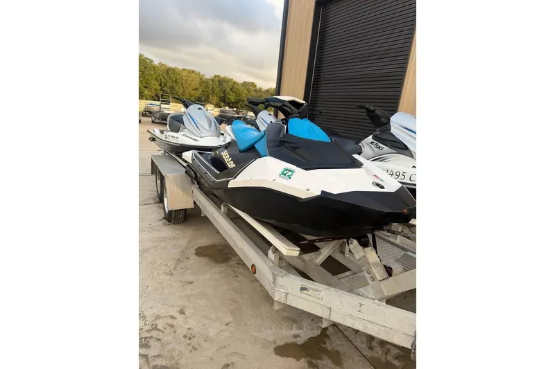 Slide: The Image of 2019 Sea-Doo Spark 2up jet ski on trailer, parked outdoors. - 4