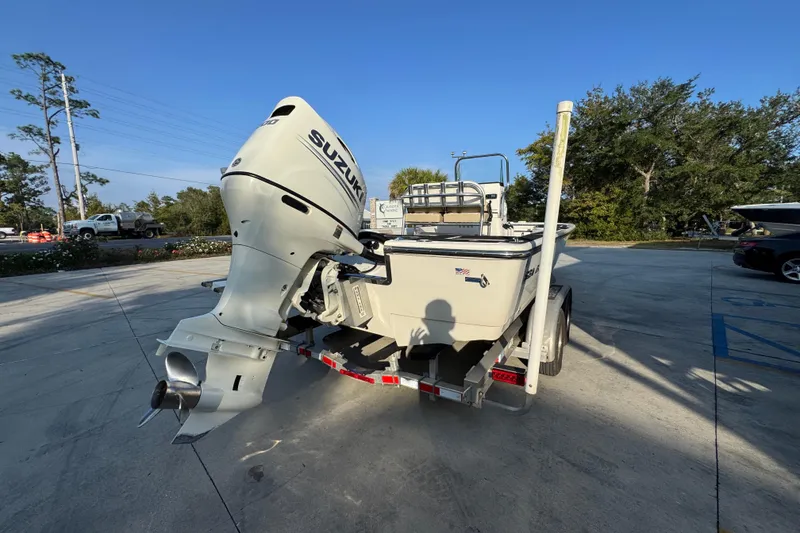 Slide: The Image of 2021 Sea Born FX24 Bay boat with Suzuki outboard motor on trailer. - 12