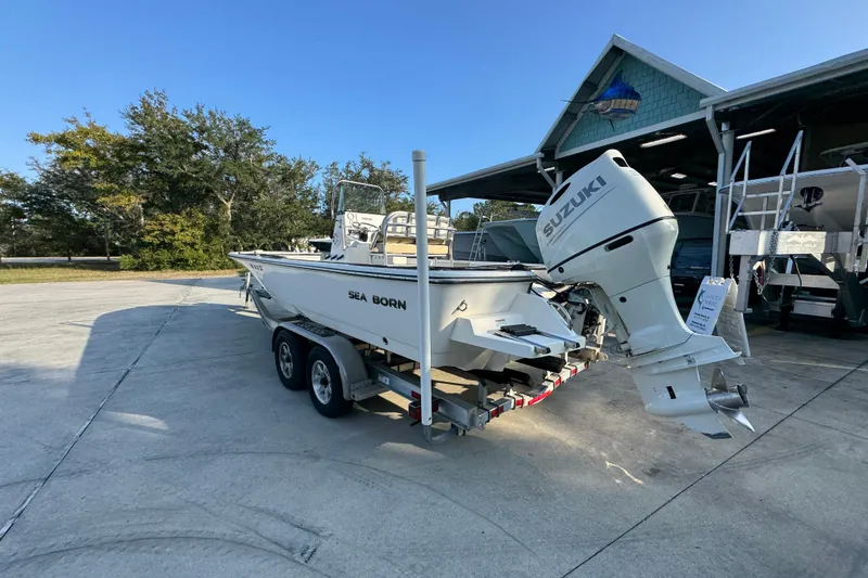 Slide: The Image of 2021 Sea Born FX24 Bay boat with Suzuki outboard motor on trailer. - 15