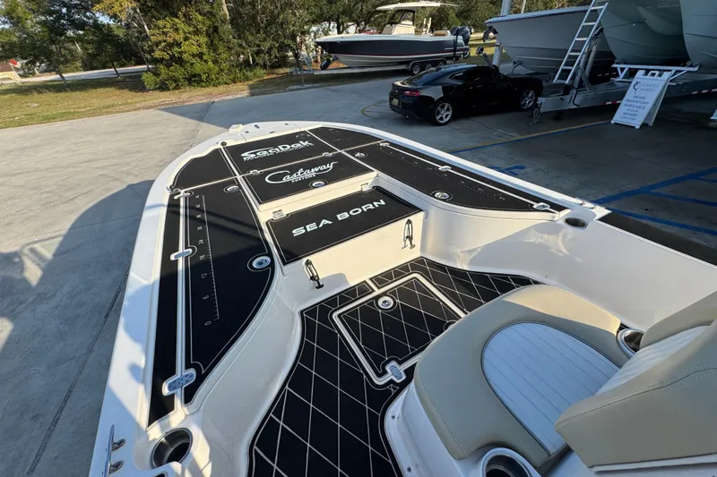 Slide: The Image of 2021 Sea Born FX24 Bay boat deck with seating and custom flooring. - 19