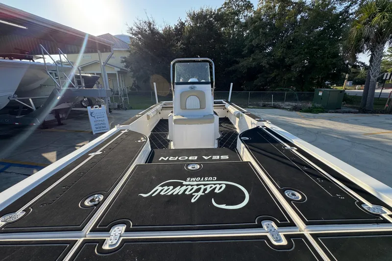 Slide: The Image of 2021 Sea Born FX24 Bay boat with custom deck, parked outdoors. - 22