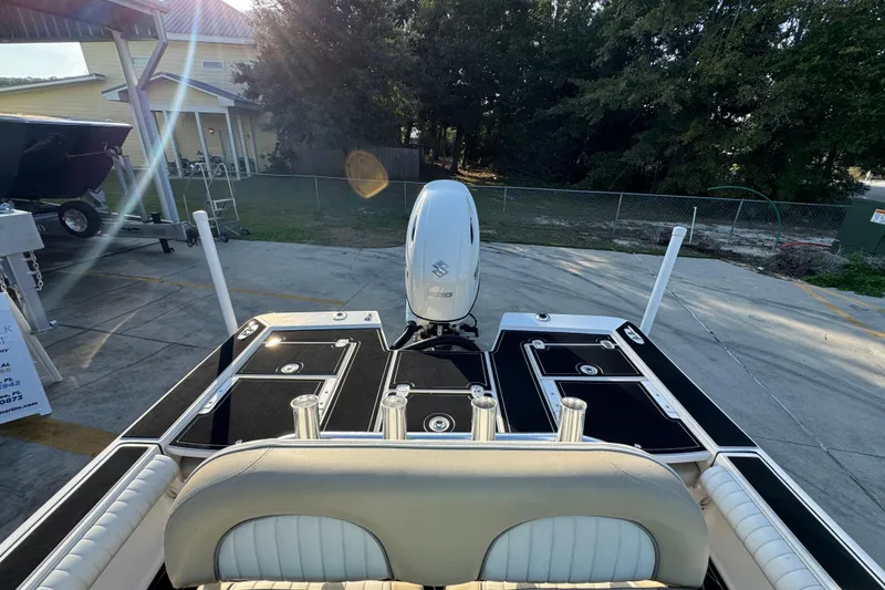 Slide: The Image of 2021 Sea Born FX24 Bay boat with outboard motor in a sunny outdoor setting. - 27