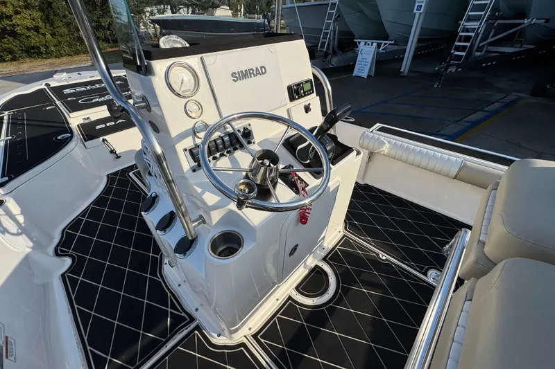 Slide: The Image of 2021 Sea Born FX24 Bay boat interior with steering wheel and control panel. - 28
