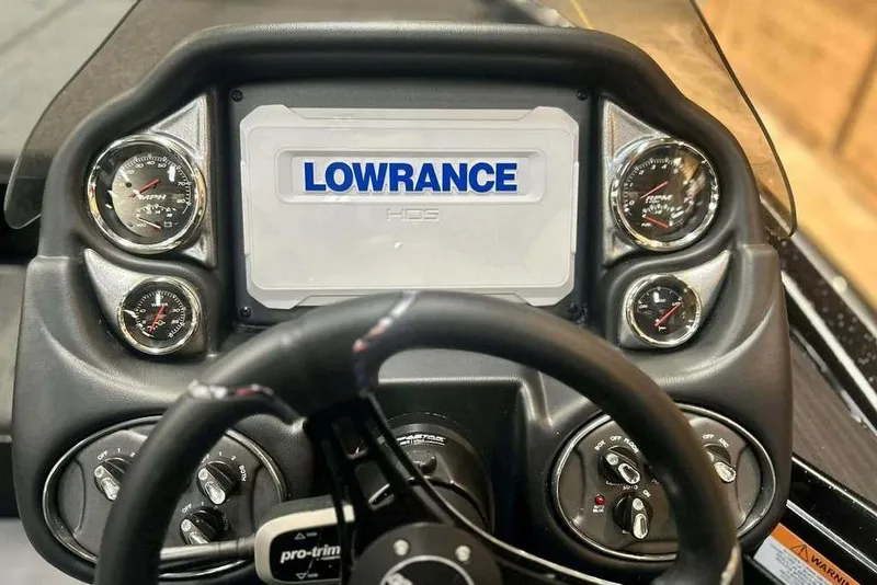 Slide: The Image of Dashboard of 2026 Triton 19 TrX Patriot boat with Lowrance display and gauges. - 4