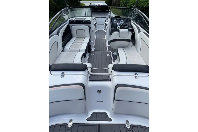 Slide: The Image of 2014 Yamaha Boats AR240 interior with sleek seating and modern dashboard design. - 3