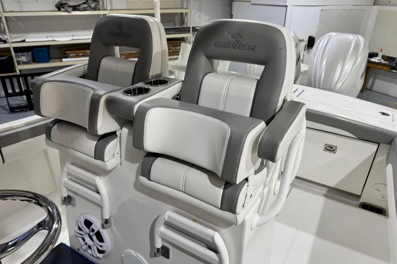 Slide: The Image of 2023 Regulator 28 boat seats with cup holders in a sleek, modern design. - 12