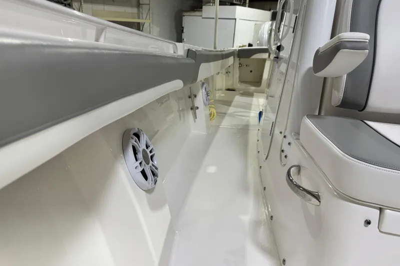 Slide: The Image of 2023 Regulator 28 boat interior with seating and speaker detail. - 20