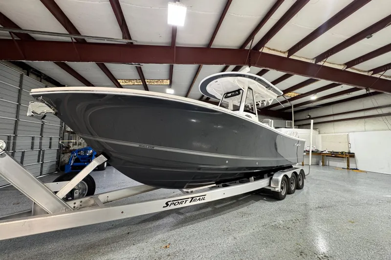 Slide: The Image of 2023 Regulator 28 boat on trailer in indoor storage facility. - 5