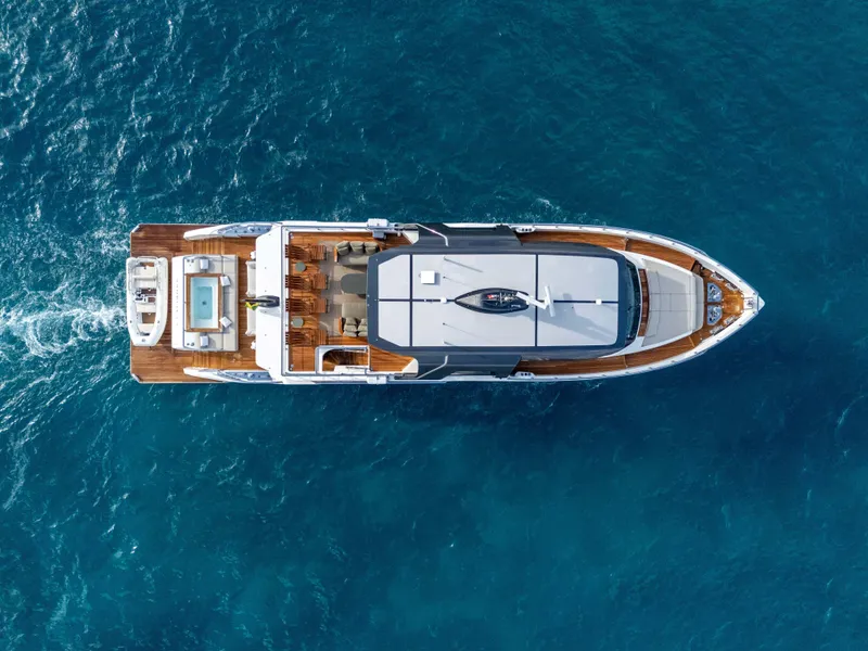 Slide: The Image of Top view of 2025 Alpha Squalo Co Ownership yacht cruising on blue ocean. - 11