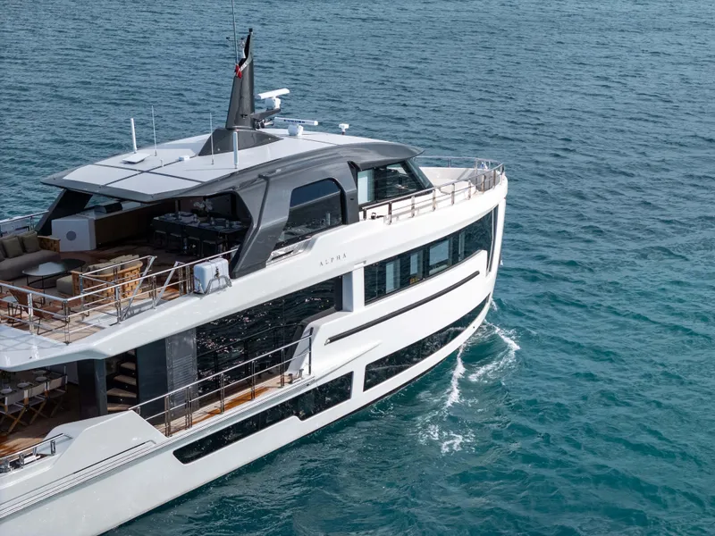 Slide: The Image of Luxury yacht "Alpha Squalo Co Ownership 2025" cruising on clear blue waters. - 14
