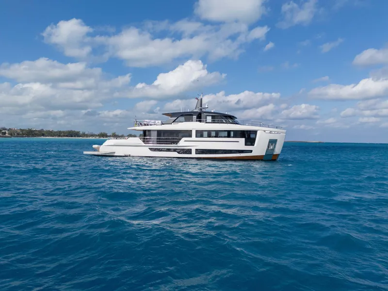 Slide: The Image of Luxurious 2025 Alpha Squalo Co Ownership yacht cruising on clear blue ocean waters. - 23