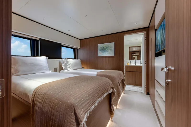 Slide: The Image of Luxurious twin bedroom on 2025 Alpha Squalo Co Ownership yacht, featuring modern design and cozy ambiance. - 25