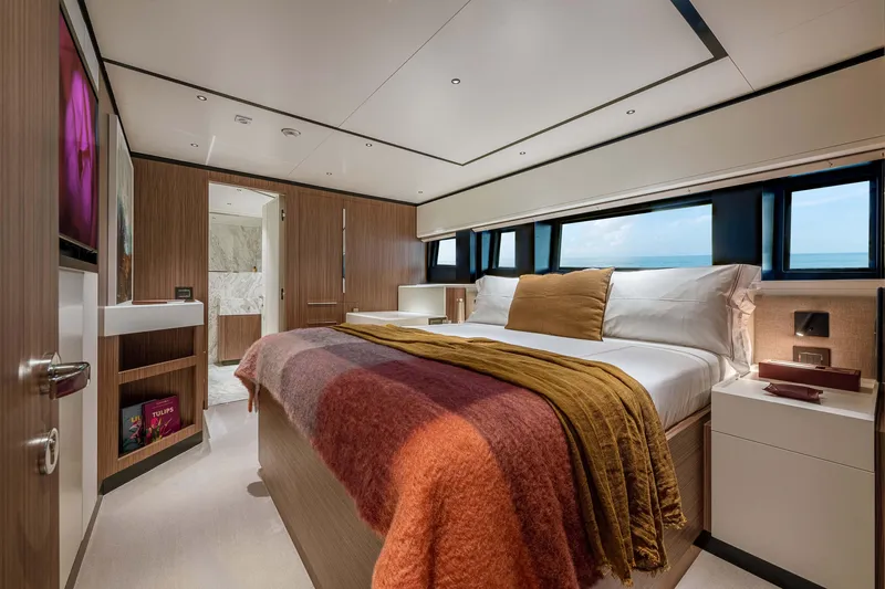Slide: The Image of Luxurious bedroom interior of 2025 Alpha Squalo Co Ownership yacht, featuring modern design and cozy bedding. - 27