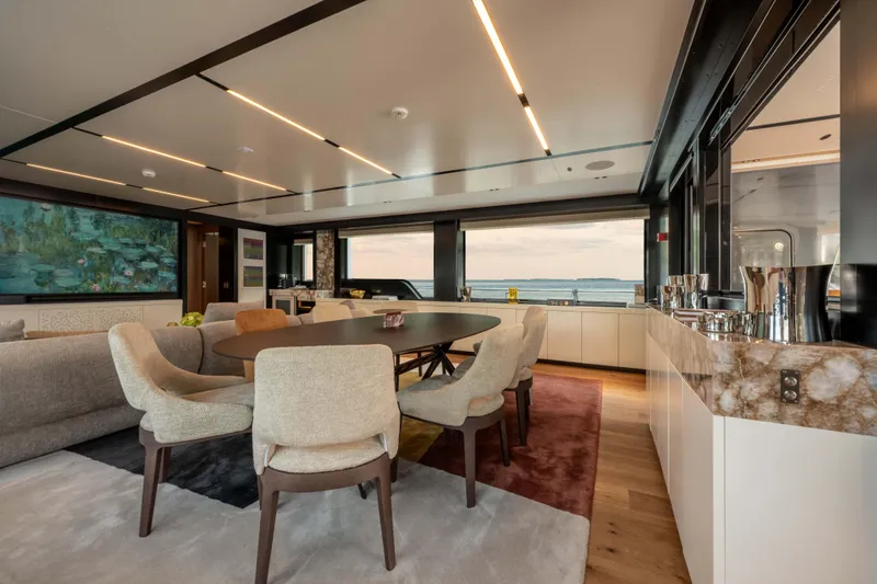 Slide: The Image of Luxurious interior of 2025 Alpha Squalo Co Ownership yacht with elegant dining area. - 31