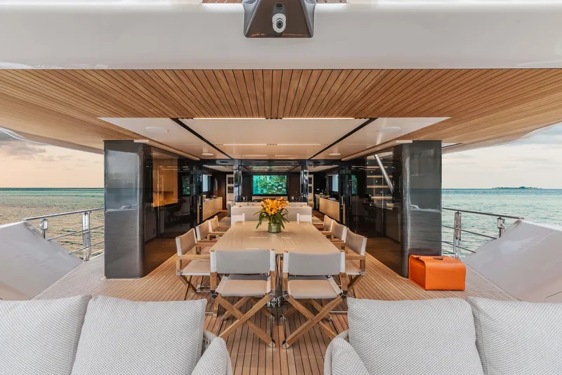Slide: The Image of Luxurious 2025 Alpha Squalo Co Ownership yacht interior with elegant dining area and ocean view. - 32