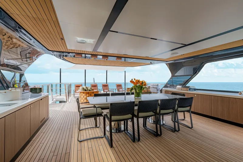 Slide: The Image of Luxurious 2025 Alpha Squalo Co Ownership yacht deck with dining area and ocean view. - 38