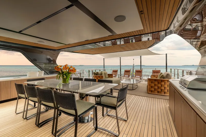 Slide: The Image of Luxurious 2025 Alpha Squalo Co Ownership yacht deck with elegant dining area and ocean view. - 39