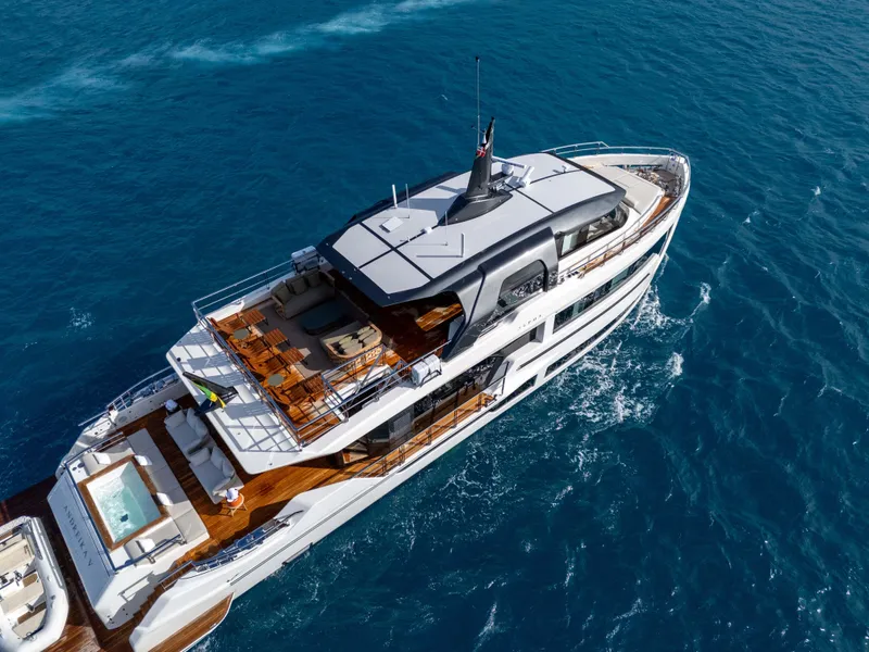 Slide: The Image of Luxurious 2025 Alpha Squalo Co Ownership yacht cruising on blue ocean waters. - 5