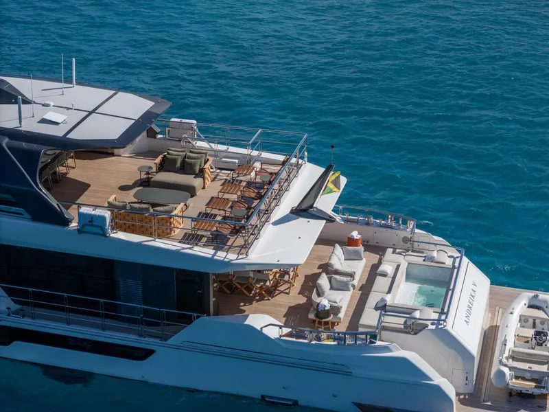 Slide: The Image of Luxurious 2025 Alpha Squalo Co Ownership yacht with spacious deck and seating on blue ocean. - 8