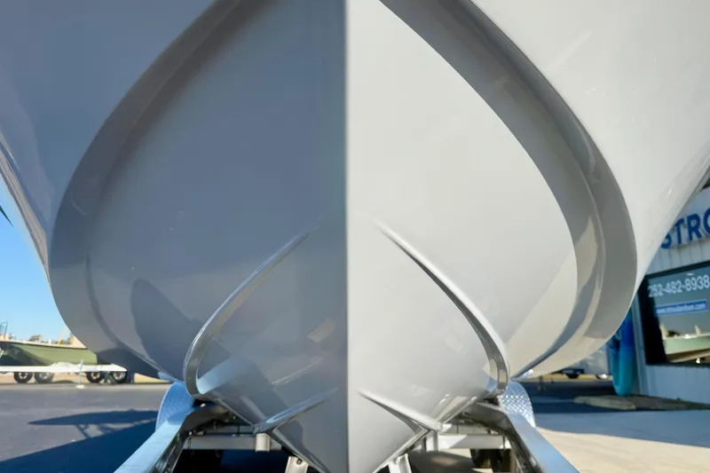 Slide: The Image of 2026 Carolina Skiff 24 Ultra Elite boat hull close-up, showcasing sleek design. - 10